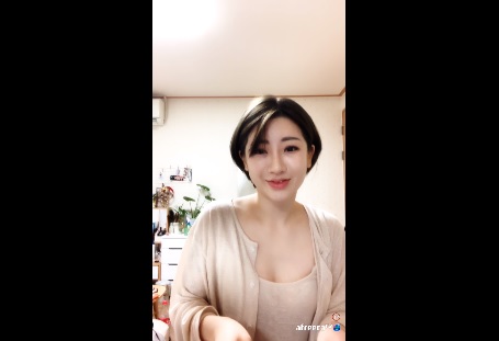 Short hair Korean woman showing off her tits